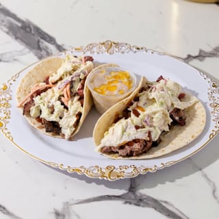 2 Pulled Pork Tacos or sliders with small side